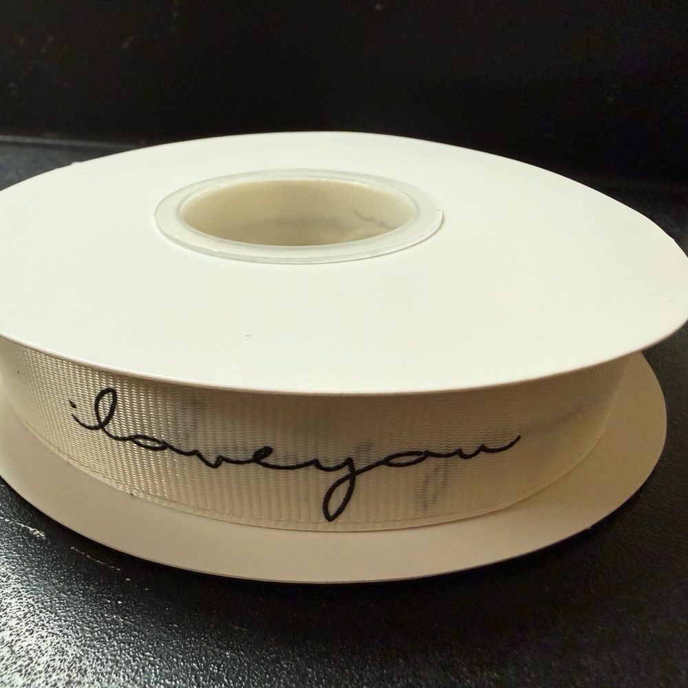 White Ribbon with Black 'Love You' Text